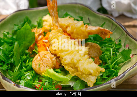 fresh deep fried Japanese tempura shrimps with salad and sea urchin Stock Photo