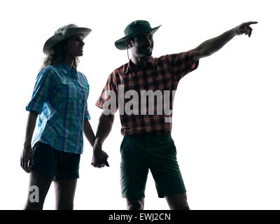 one caucasian couple trekker trekking nature pointing in silhouette isolated on white background Stock Photo