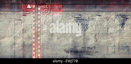 Gray grungy barge hull texture with draft scale Stock Photo
