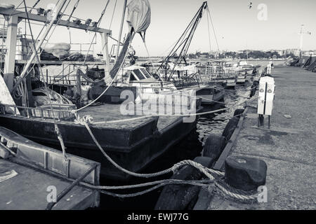 Small fishing boats with fishing net and equipment, motor boat or sail boat  floating Stock Photo - Alamy