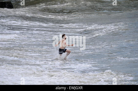 Brighton, UK. 27th June, 2015. - Swimmers enjoy the hot weather on Brighton beach today with temperatures rising to the low 20s centigrade Stock Photo