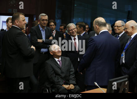 Brussels, Belgium. 27th June, 2015. German Finance Minister Wolfgang Schaeuble (C) speaks with eurogroup finance ministers and their delegations during a Eurozone finance ministers emergency meeting on the situation in Greece in Brussels, Belgium, June 27, 2015. Credit:  Ye Pingfan/Xinhua/Alamy Live News Stock Photo