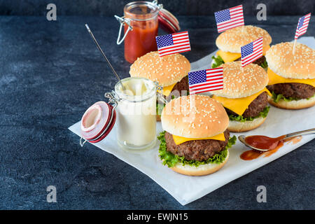 Mini beef cheeseburgers with American flags on top,selective focus Stock Photo