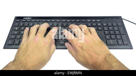 Man typing on a computer keyboard on a white background. Stock Photo