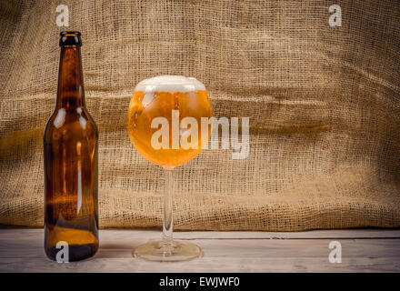 Beer in a glass on a wooden table Stock Photo
