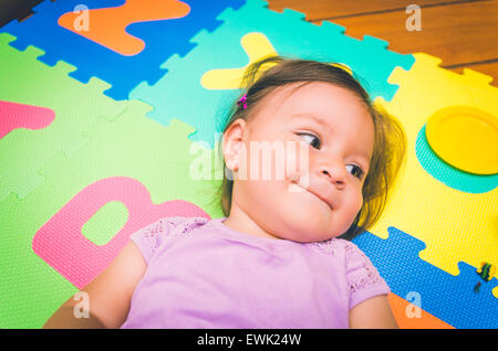 Beautiful baby girl lying down Stock Photo