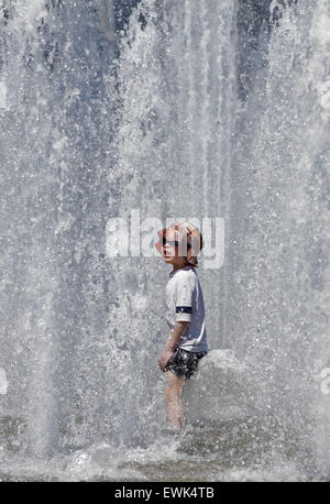 Vancouver, Canada. 27th June, 2015. A child enjoys a fountain at a park in Vancouver, Canada, June 27, 2015. According to the weather forecast from Environment Canada, heat wave warning was issued in Vancouver with temperature expected to rise dramatically over the weekend with about 30 degree Celsius. The inland of British Columbia may hit at 40 degree. © Liang sen/Xinhua/Alamy Live News Stock Photo