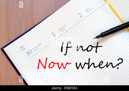 Yellow blank notepad on office wooden table and text concept Stock Photo