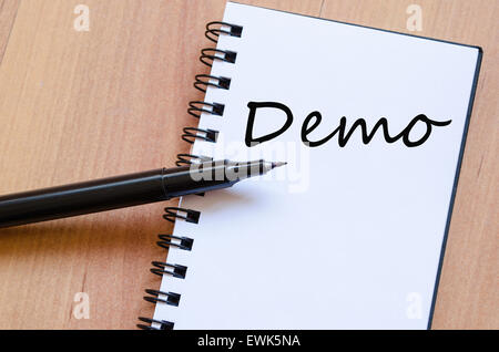 White notepad and ink pen on the wooden desk  and text concept Stock Photo