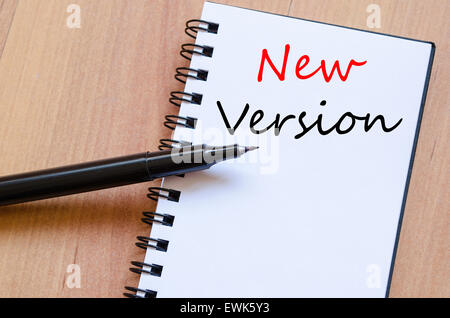 White blank notepad on office wooden table and text concept Stock Photo