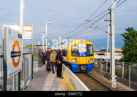 Willesden Junction railway station platform with 5 car Overground train, London, England, U.K. Stock Photo