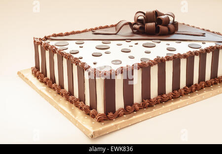 Chocolate cake on white background, decoration details. Stock Photo