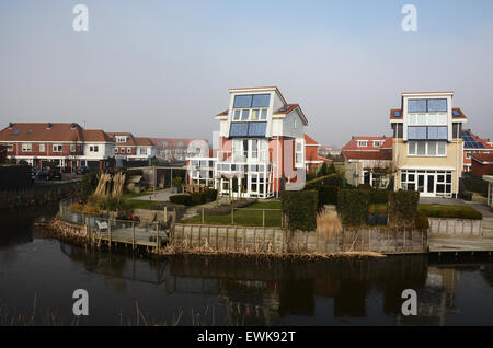 domestic houses with integrated solar panels generating electricity, Egmond Netherlands Europe Stock Photo