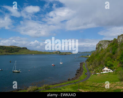 View down to Kerrera Island and yachts moored in Sound of Kerrera popular tourist resort town Oban Argyll and Bute Scotland on lovely May day weather Stock Photo