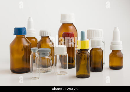many medical bottles with caps on a white background Stock Photo