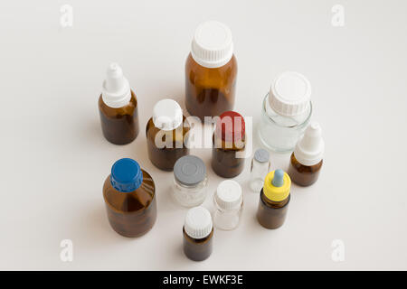 many medical bottles with caps on a white background Stock Photo