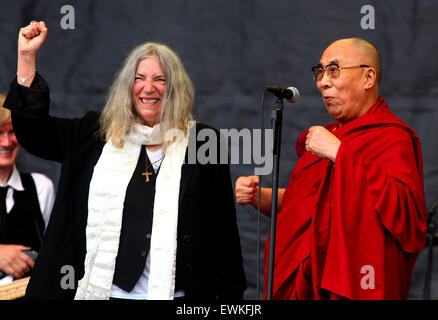 Glastonbury, UK. 28th June, 2015.   Patti Smith welcomes the 14th Dalmi Lama onto the Pyramid Stage during her performance at the 2015 Glastonbury Festival. Credit:  Apex/Alamy Live News Stock Photo