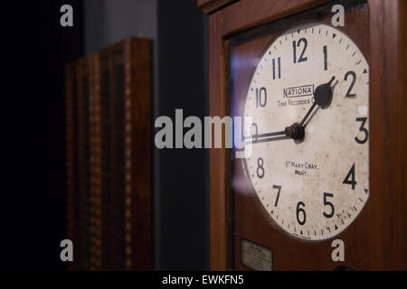 Clocking on, time recording machine on display at Coventry Transport Museum Stock Photo