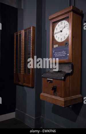 Clocking on, time recording machine on display at Coventry Transport Museum Stock Photo