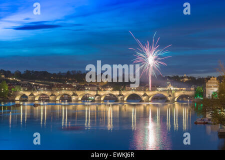 Charles Bridge Prague night, view of fireworks exploding above the famous medieval Charles Bridge in Prague at night, Czech Republic. Stock Photo