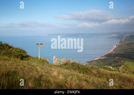 Signpost and Kissing Gate on the South West Coast Path, overlooking Lyme Bay. Dorset. England. UK. Stock Photo