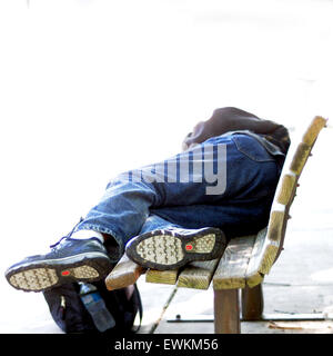 Black homeless man sleeping in park Stock Photo - Alamy