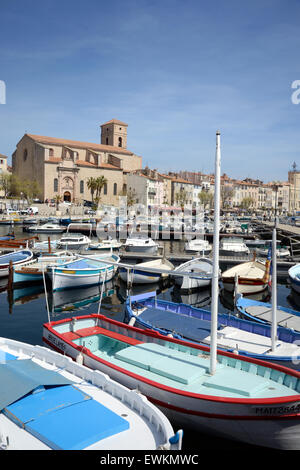 Traditional Wooden Fishing Boats in the Harbour, Old Port or Marina at La Ciotat & Church or Eglise Notre-Dame-de-l'Assomption Provence France Stock Photo