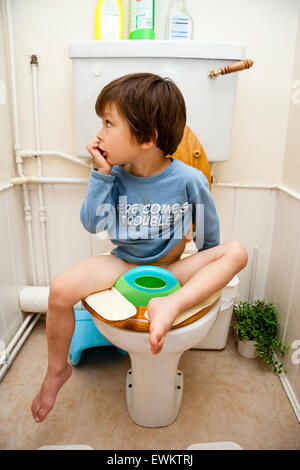 Portrait Of Cute Kid Holding Toilet Roll Standing In The 
