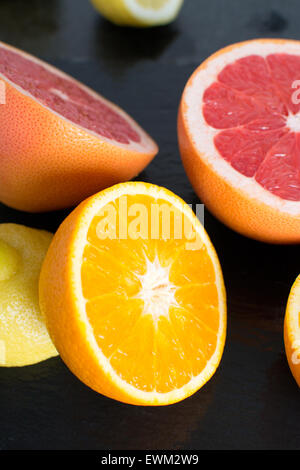 Fresh sliced citrus on a slate platter Stock Photo