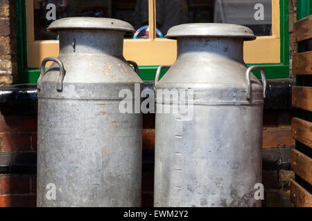 Milk churns on the platform at Sheringham Train Station, Norfolk, England, U.K. Stock Photo