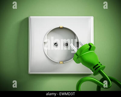 Electric plug and socket on green wall. Stock Photo