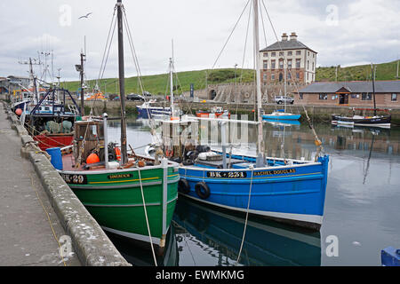 fishing boats moored in eyemouth harbour Stock Photo