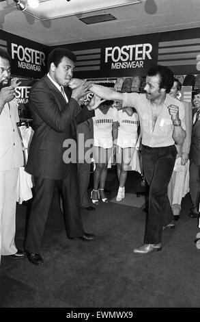 Muhammad Ali Visiting the Bull Ring Shopping Centre in Birmingham. Pictured here in Debenhams Department Store with John Conteh 7th June 1979. Stock Photo