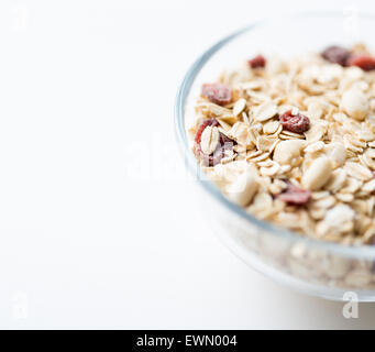close up of bowl with granola or muesli on table Stock Photo