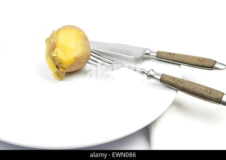 Potato peeling on table Stock Photo