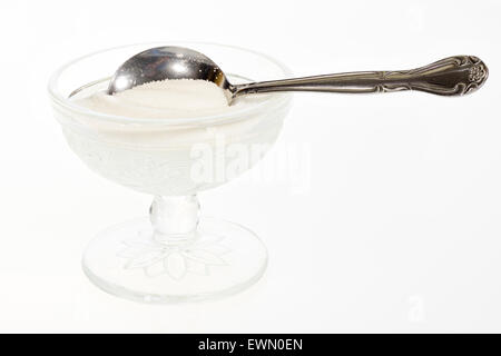 Small bowl of sugar and teaspoon Stock Photo