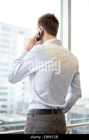 businessman calling on smartphone in office Stock Photo