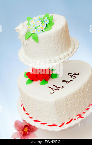 Closeup view of various wedding cakes models on blue background Stock Photo