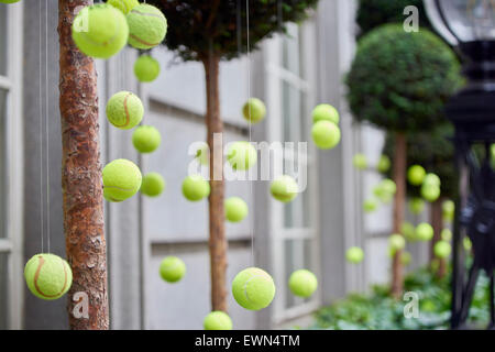 LONDON, UK - JUNE 23: Tennis balls decoration in front of Rosewood Hotel. June 23, 2015 in London. Two main tennis competitions Stock Photo
