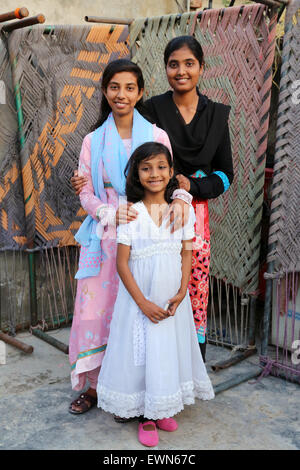 Three female sisters from a christian family in Youhanabad Christian Colony, Lahore, Pakistan Stock Photo