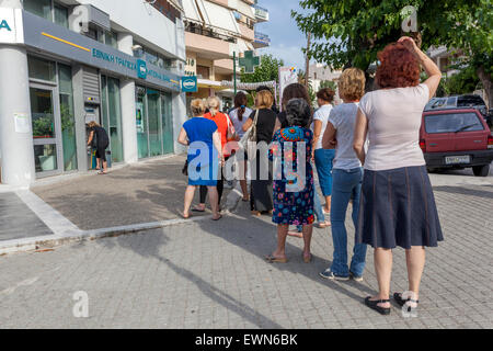 Crete, Greece. 28th June, 2015. People withdraw money  from ATMs, Rethymno, Crete, Greece Stock Photo