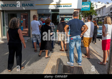 Crete, Greece. 28th June, 2015. People withdraw money  from ATMs, Rethymno, Crete, Greece Stock Photo