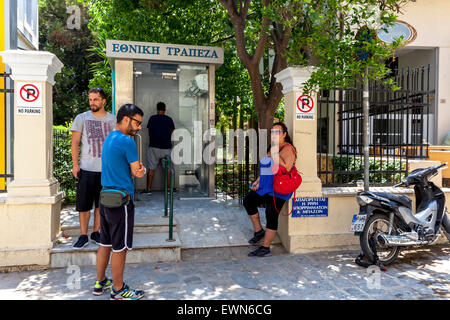 Crete, Greece. 28th June, 2015. People withdraw money  from ATMs, Rethymno, Crete, Greece Stock Photo