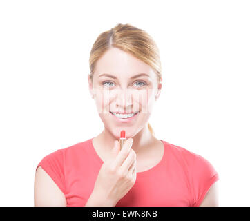 Woman applying lipstick. Stock Photo