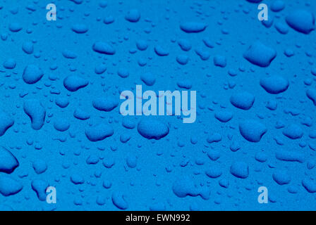 Waterdrops on blue surface Stock Photo