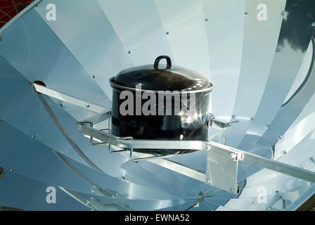 Solar cooker with black saucepan Stock Photo