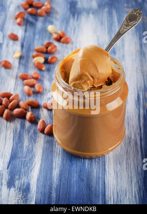 Peanut butter in  jar with peanuts.  Shallow dof. Stock Photo