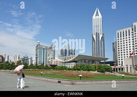 Fountain with people and children on People's Square Municipal Government Building Shanghai Municipality China skyline city Stock Photo