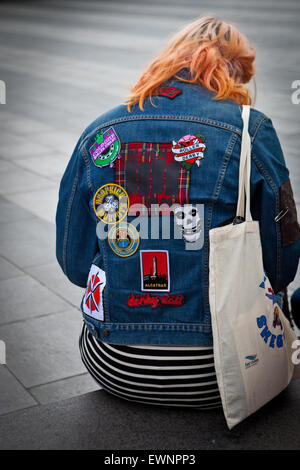 Punk girl with patches on denim jacket Stock Photo