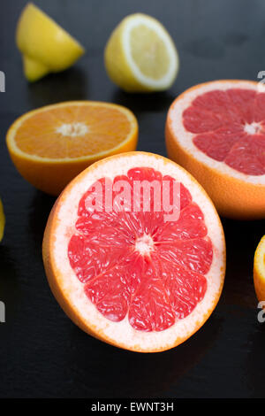 Fresh Sliced grapefruit on a slate platter Stock Photo